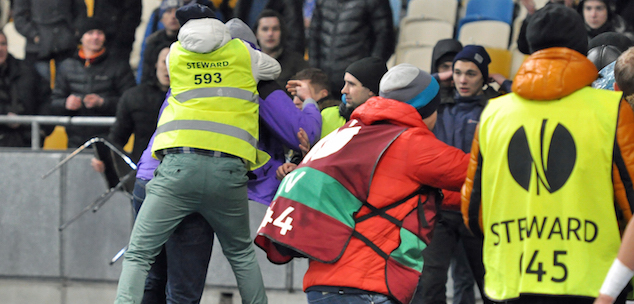 Stewards tried to hold off the fight between fans